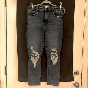 Good American jeans High waisted , worn once . size 12/31. Distressed .